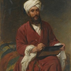 An Oriental man writing